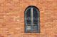 125404_stock-photo-9032464-arched-window-on-bright-red-brick-wall-building-exterior-architectural.jpg
